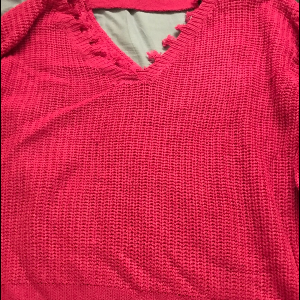 A hot pink long sleeve shirt